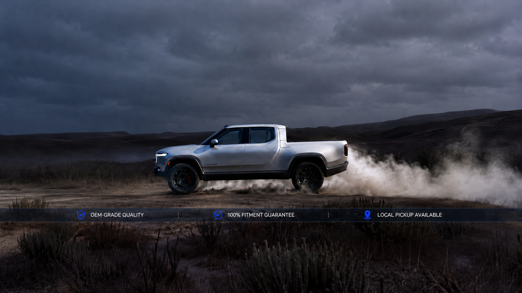 White pickup truck driving through a desert landscape.